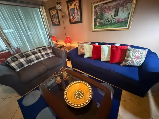 a living room with a couch and a table