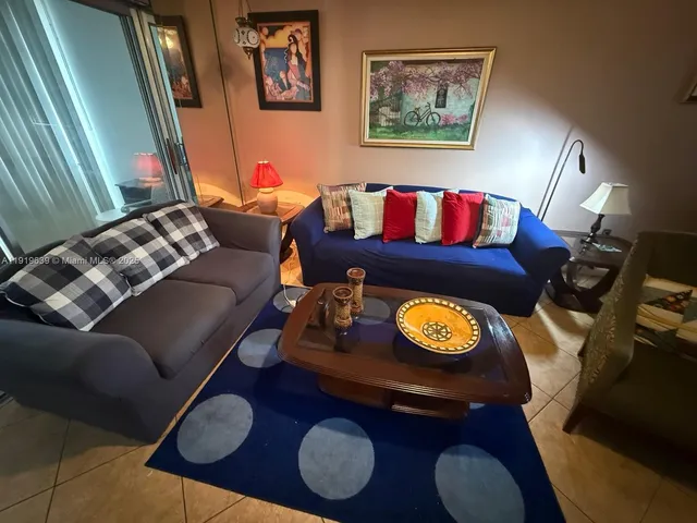 a living room with furniture and rug