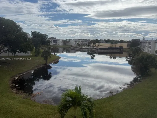 a view of a lake with a yard