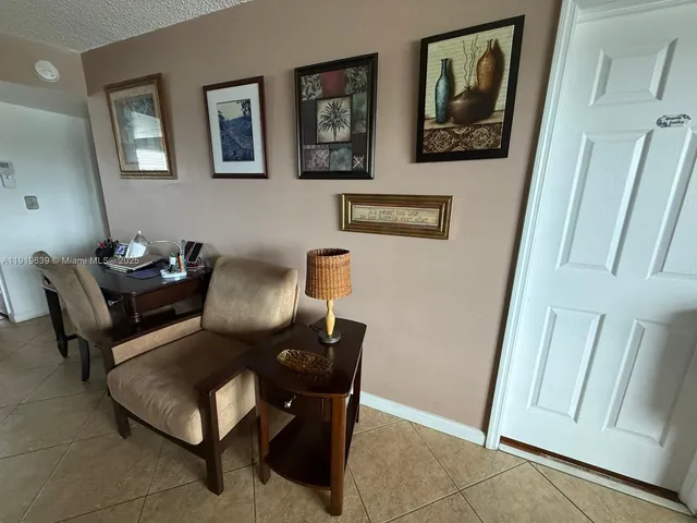a view of a workspace with furniture and a couch
