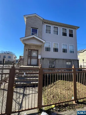 a front view of a house with glass windows