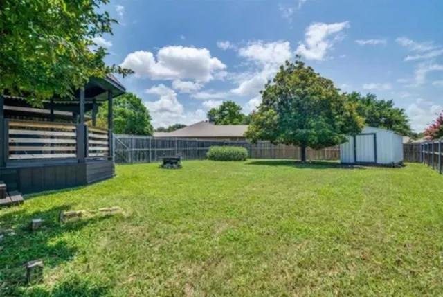 a view of a backyard with a garden