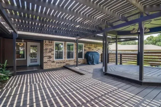 a view of a room with wooden floor