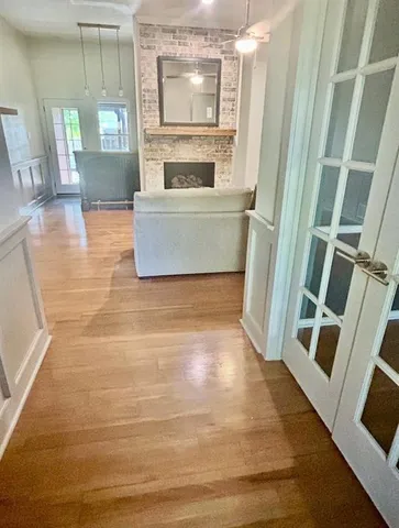 a view of kitchen and wooden floor