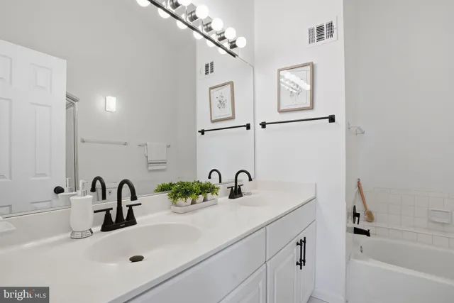 a bathroom with a sink and a bathtub