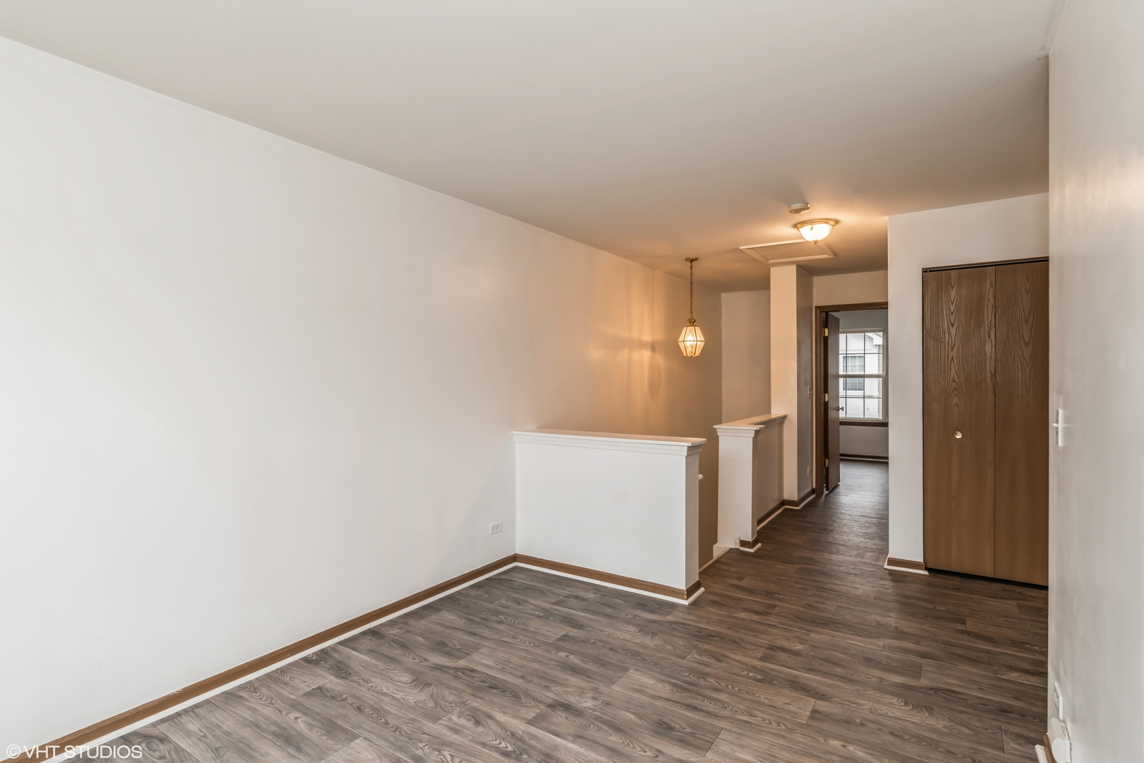 274 Holiday Lane Hainesville, IL 60073 - Photo 17 of 20 a view of a hallway with wooden floor