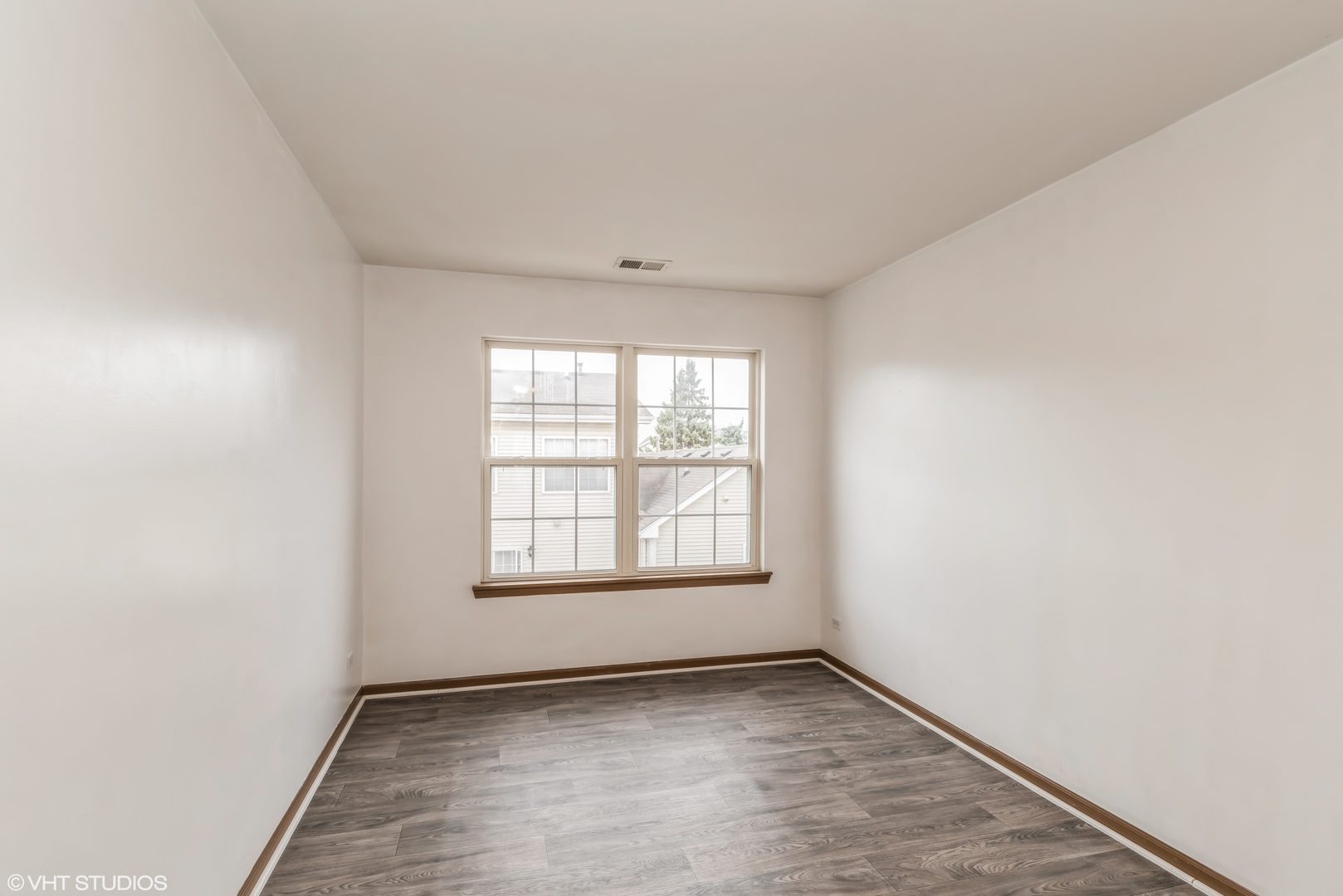 274 Holiday Lane Hainesville, IL 60073 - Photo 9 of 20 an empty room with windows