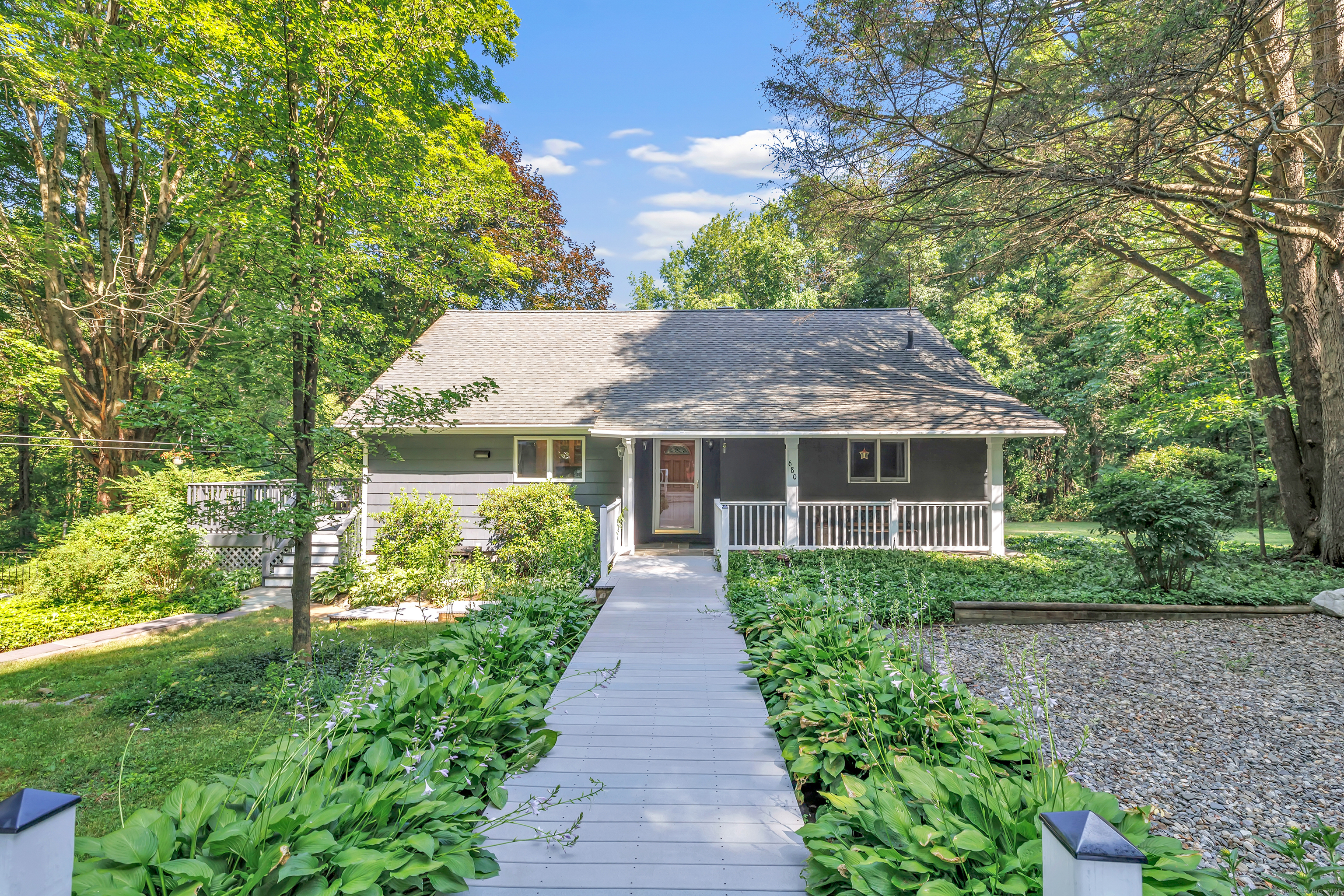 a front view of house with yard and green space