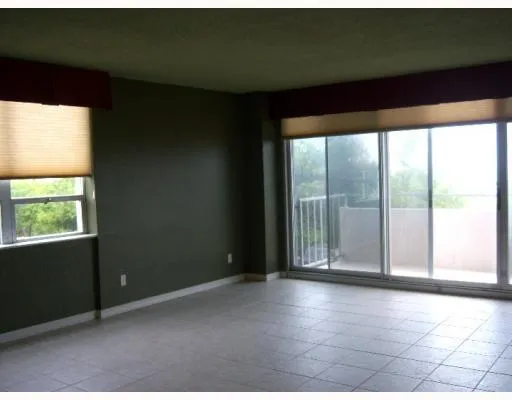 a view of a room with large windows