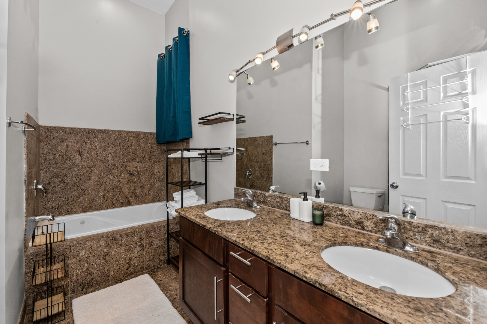 2421 West Warren Boulevard, Unit 3 Chicago, IL 60612 - Photo 11 of 14 a bathroom with a granite countertop double vanity sink and a mirror