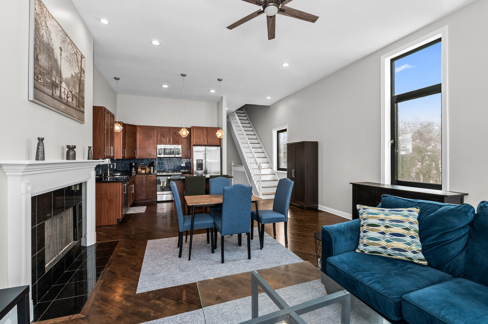 2421 West Warren Boulevard, Unit 3 Chicago, IL 60612 - Photo 5 of 14 a living room with furniture a fireplace and a flat screen tv