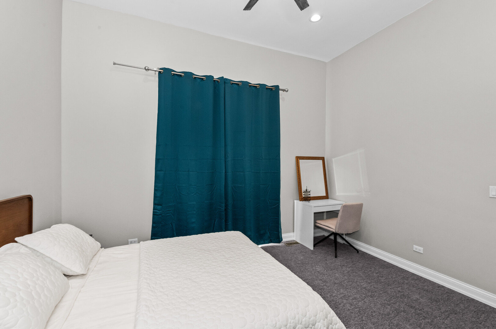 2421 West Warren Boulevard, Unit 3 Chicago, IL 60612 - Photo 10 of 14 a bedroom with a bed and a chair