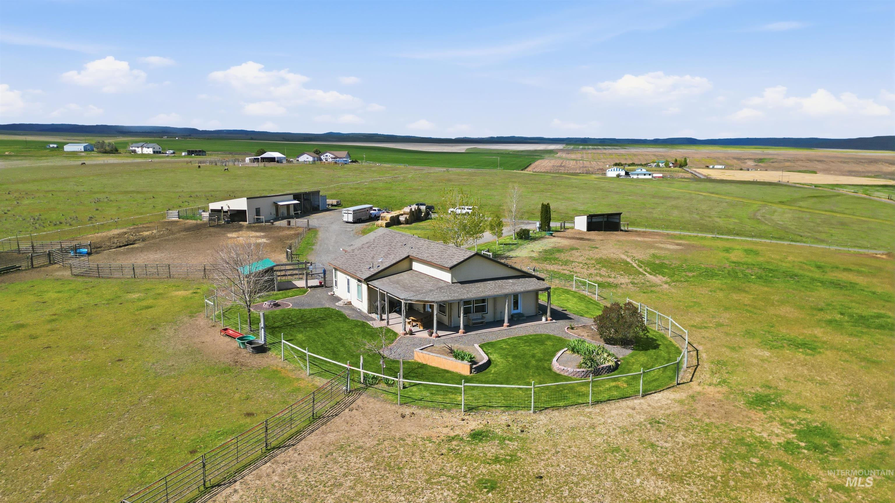 19397 Cloverland Road Asotin, WA 99402 - Photo 25 of 37 Ranch-style dwelling featuring a covered front porch, fenced yard area, and expansive surrounding acreage