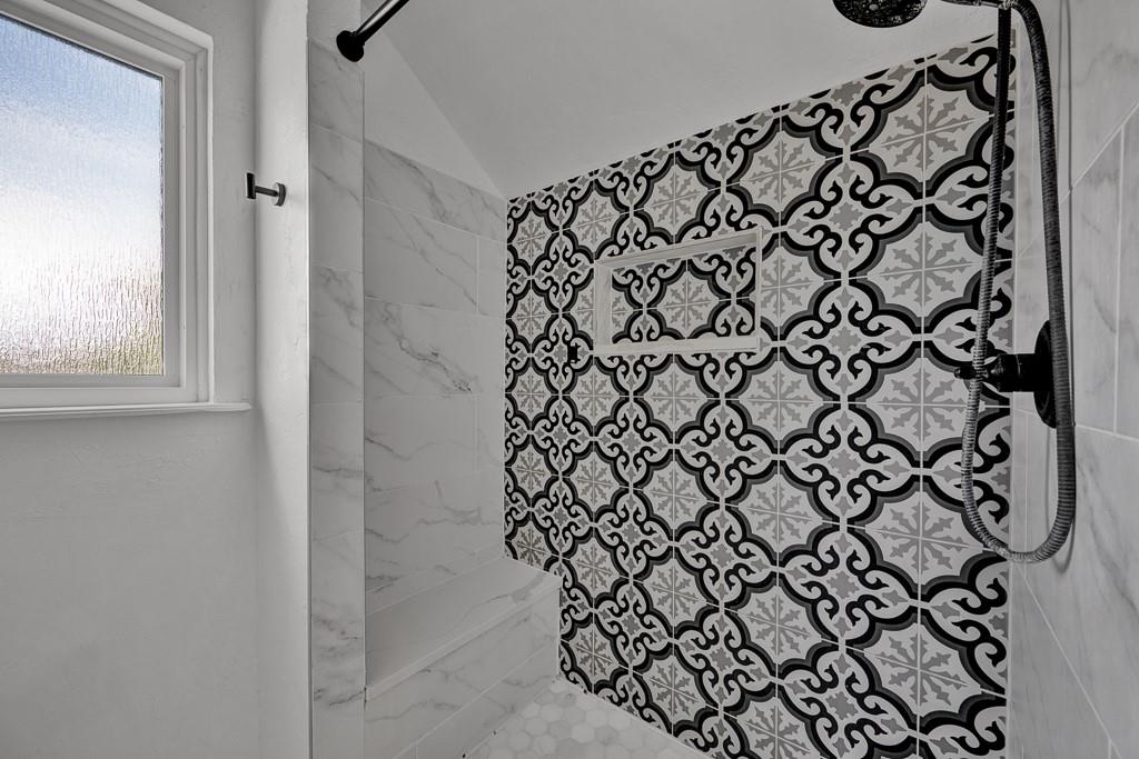 6117 Gainsborough Road Amarillo, TX 79106 - Photo 35 of 40 a bathroom with a bathtub and shower