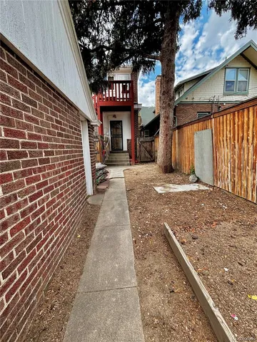 a view of a street with a building in the background
