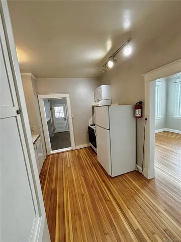 a view of a kitchen from the hallway