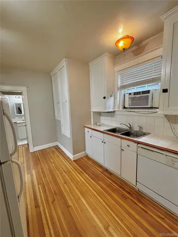 a kitchen with a sink and cabinets