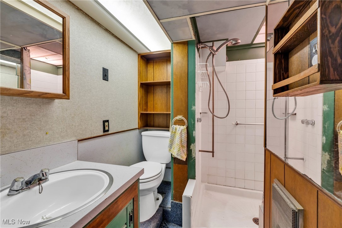 390 Hilliard Road Elyria, OH 44035 - Photo 25 of 30 Bathroom in the basement with a stall shower and vanity