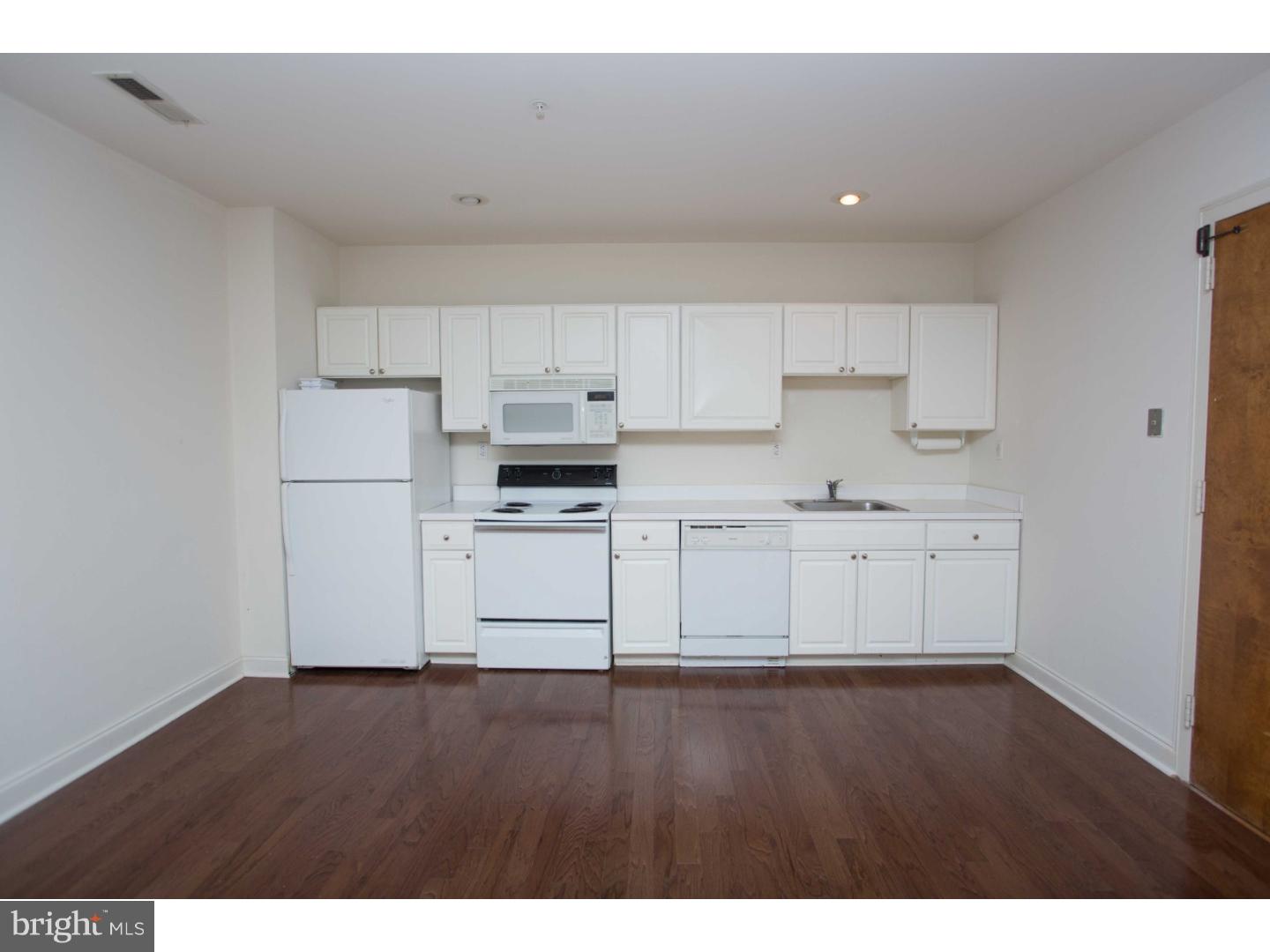 1411-3 Walnut Street, Unit 502 Philadelphia, PA 19102 - Photo 6 of 15 a view of kitchen with wooden floor