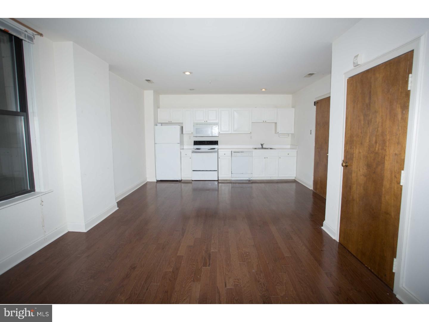 1411-3 Walnut Street, Unit 502 Philadelphia, PA 19102 - Photo 9 of 15 a view of a kitchen with wooden floor