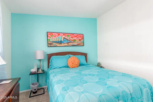 a bathroom with a sink a toilet and shower curtain
