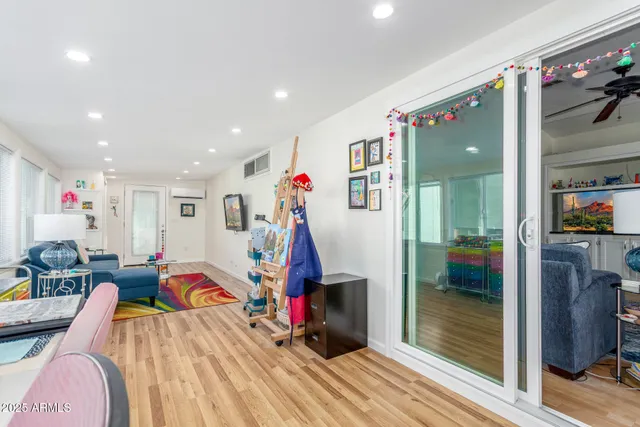 a view of a patio with a table and chairs under an umbrella