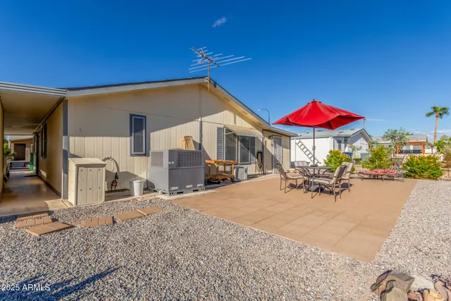 a view of a house with sitting area and furniture