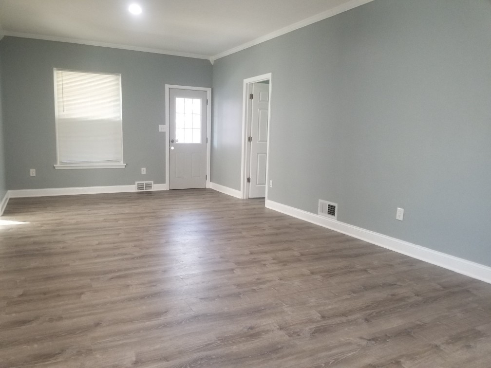 1010 Tonti Street LaSalle, IL 61301 - Photo 5 of 5 an empty room with wooden floor and windows
