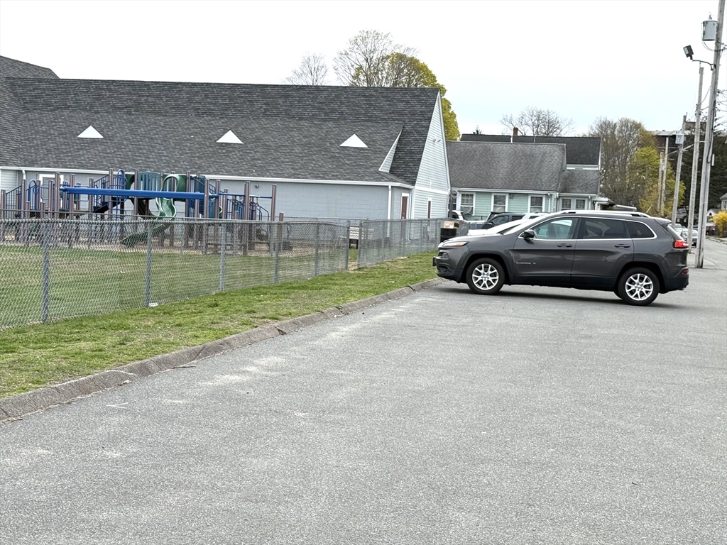 26 Harrison Street, Unit 1 Quincy, MA 02169 - Photo 13 of 14 a view of a car parked in the yard