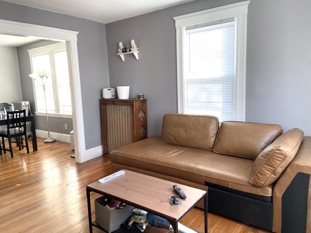 26 Harrison Street, Unit 1 Quincy, MA 02169 - Photo 2 of 14 a living room with furniture and a window