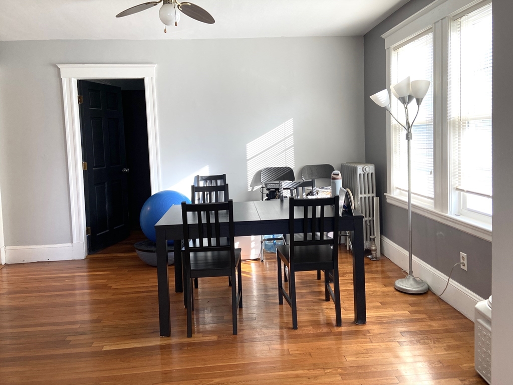26 Harrison Street, Unit 1 Quincy, MA 02169 - Photo 3 of 14 a view of a dining room with furniture and wooden floor