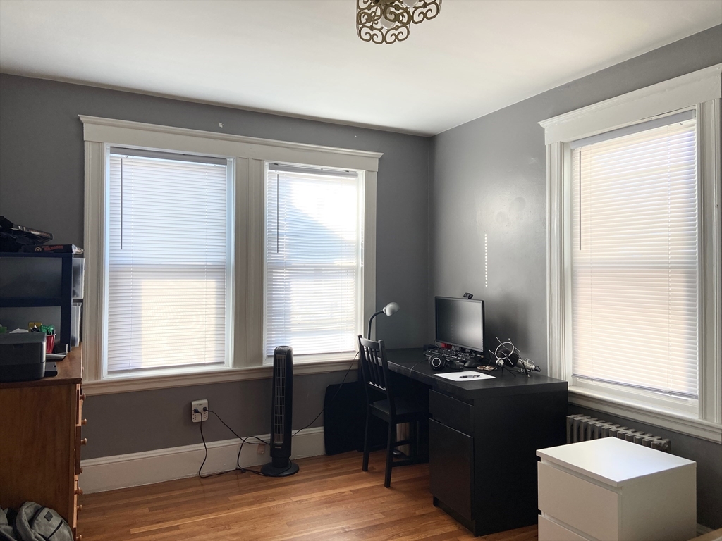 26 Harrison Street, Unit 1 Quincy, MA 02169 - Photo 10 of 14 a living room with furniture and a window
