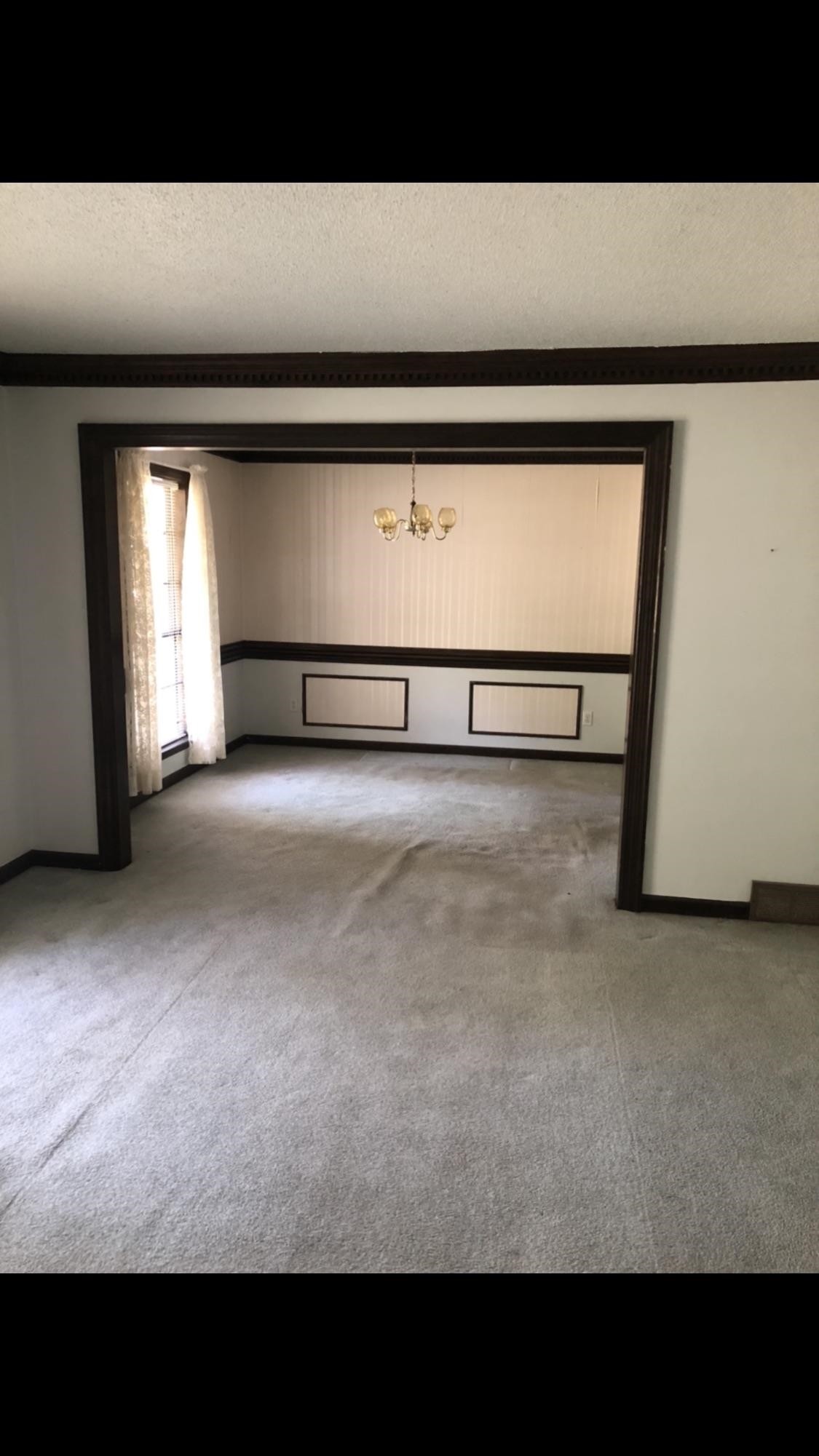 7656 Hollow Fork Road Germantown, TN 38138 - Photo 3 of 5 a view of an empty room with a window