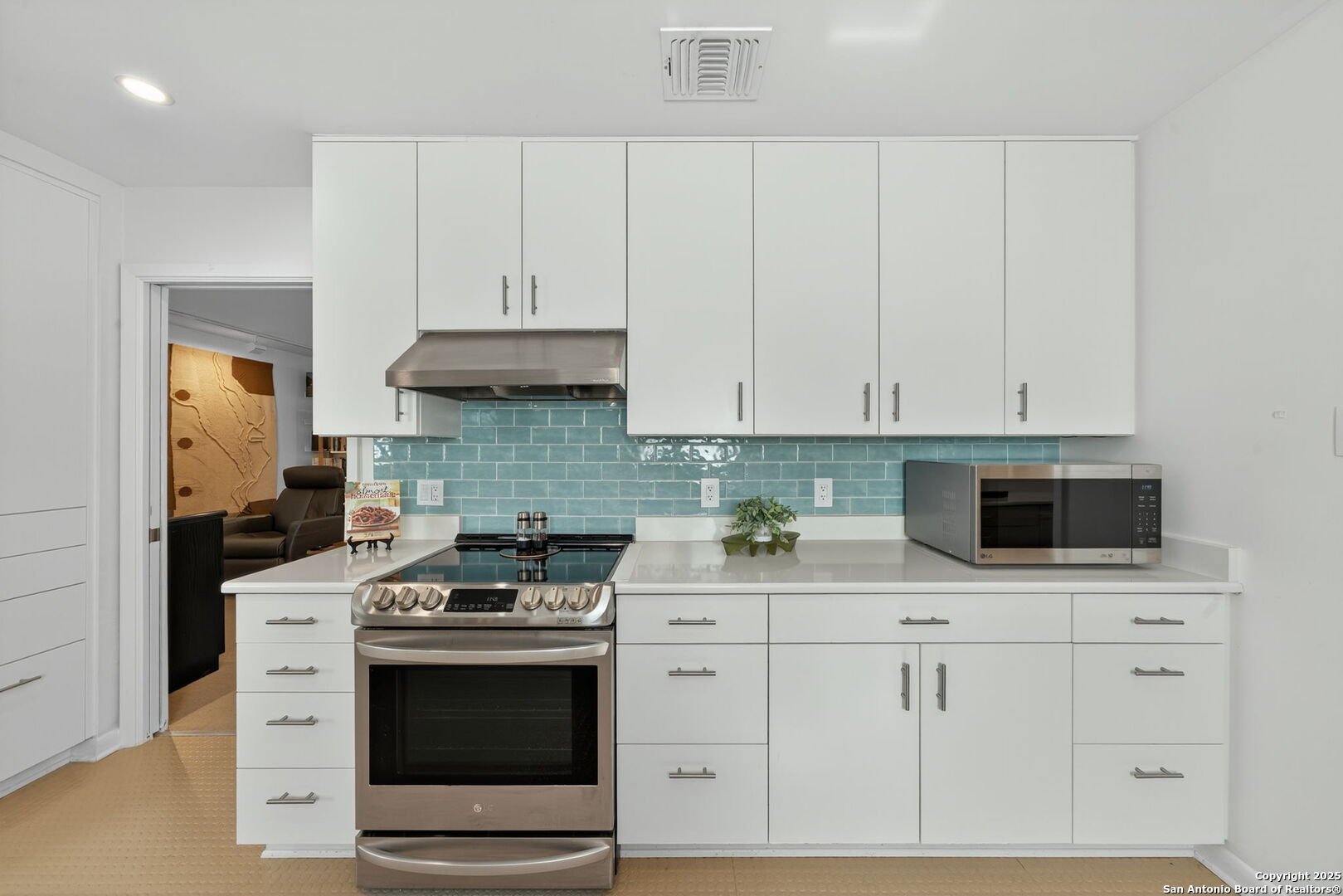 300 Towne Vue Drive Castle Hills, TX 78213 - Photo 12 of 31 a kitchen with white cabinets and appliances