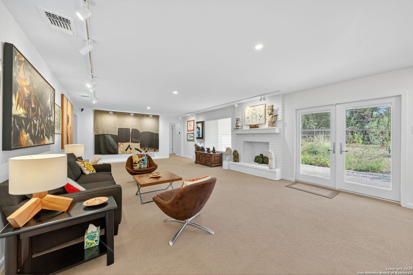 300 Towne Vue Drive Castle Hills, TX 78213 - Photo 7 of 31 a living room with furniture a fireplace and a flat screen tv