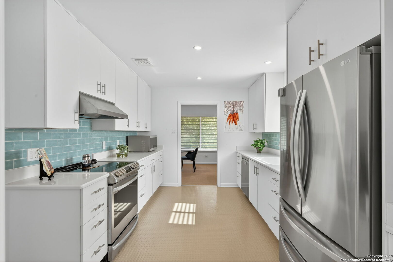300 Towne Vue Drive Castle Hills, TX 78213 - Photo 10 of 31 a kitchen with stainless steel appliances a stove a sink and a refrigerator