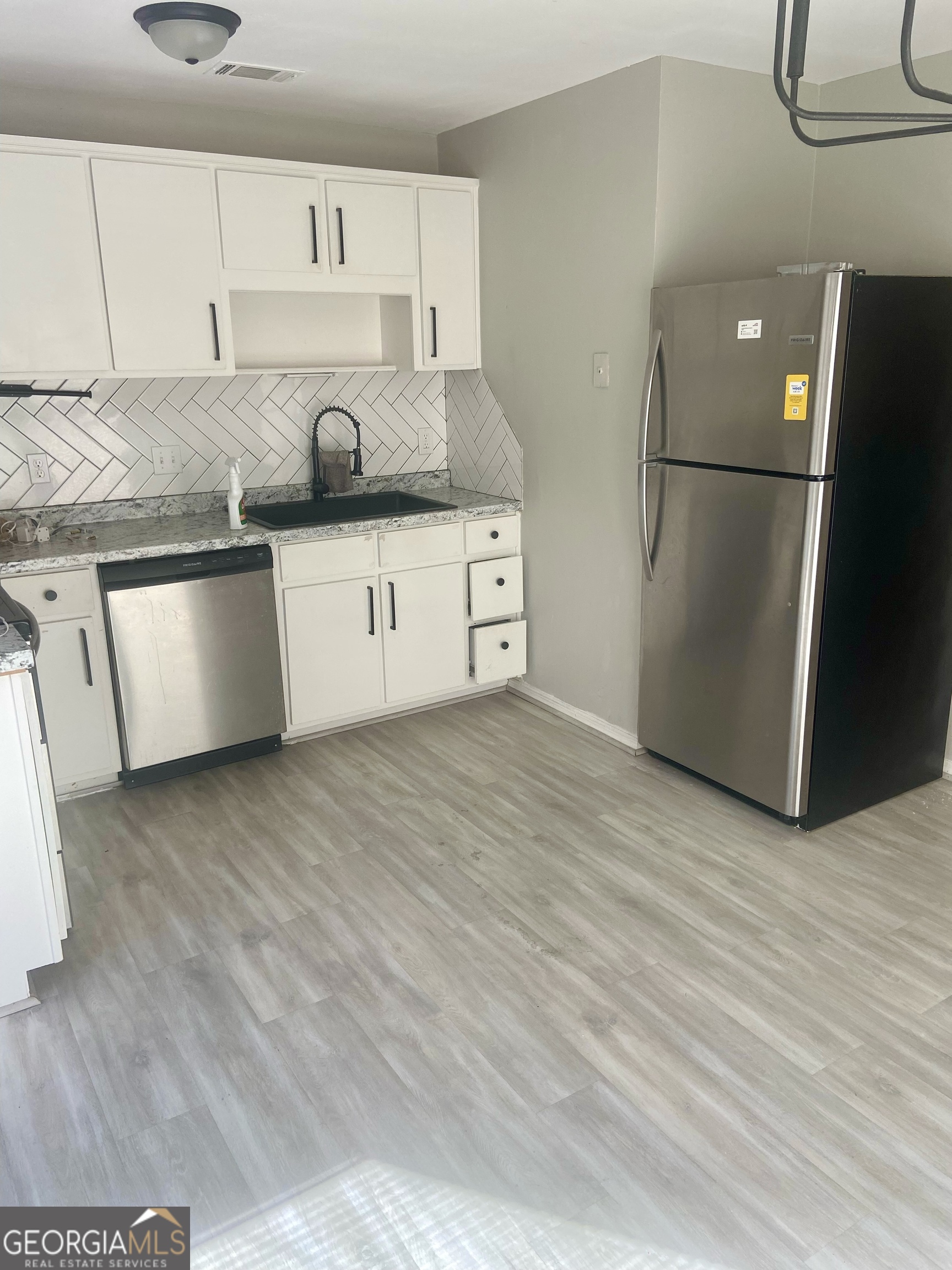 2216 Hunter Court Columbus, GA 31907 - Photo 2 of 16 a kitchen with stainless steel appliances granite countertop a refrigerator a sink and a stove