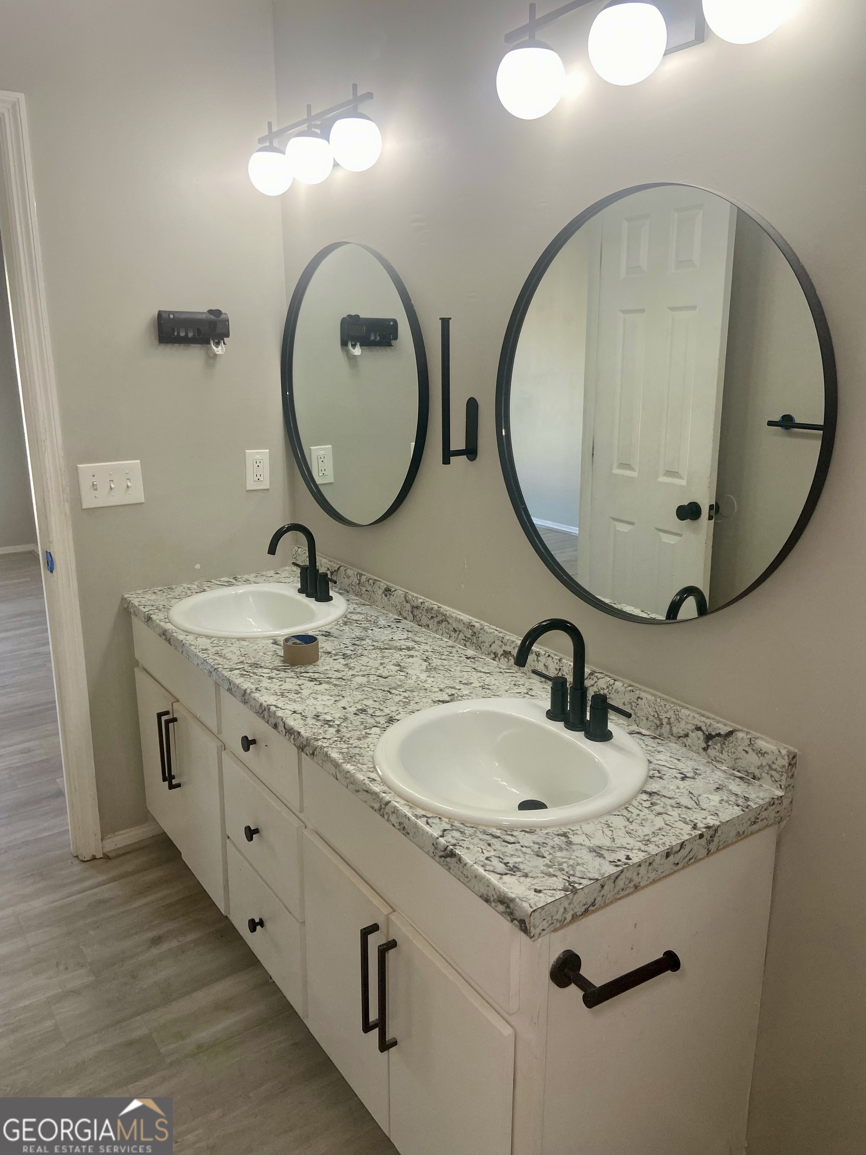 2216 Hunter Court Columbus, GA 31907 - Photo 8 of 16 a bathroom with a granite countertop sink and a mirror