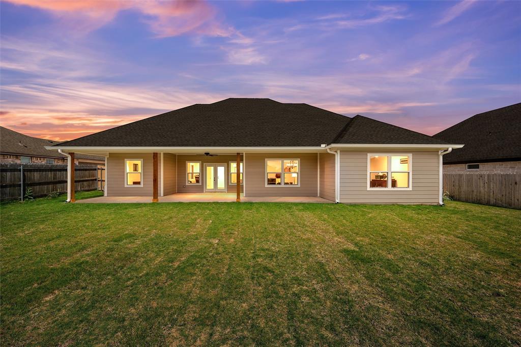 929 Northern Dancer Drive Hewitt, TX 76643 - Photo 32 of 36 a view of a big house with a big yard and a large tree