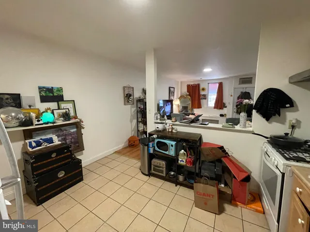 a kitchen with a sink and a stove top oven