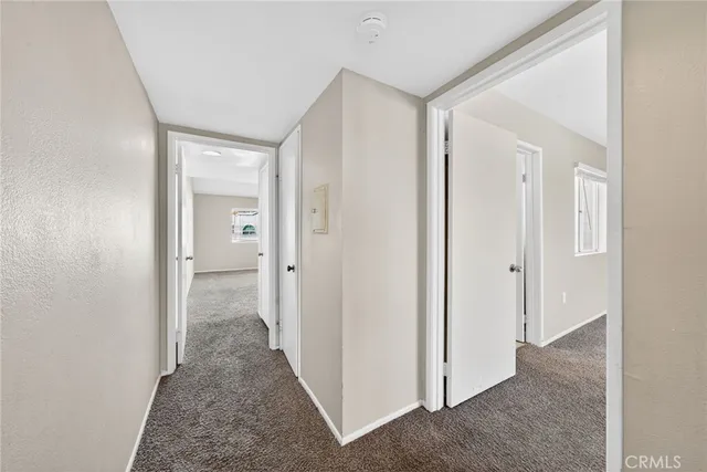 a view of a hallway with a room