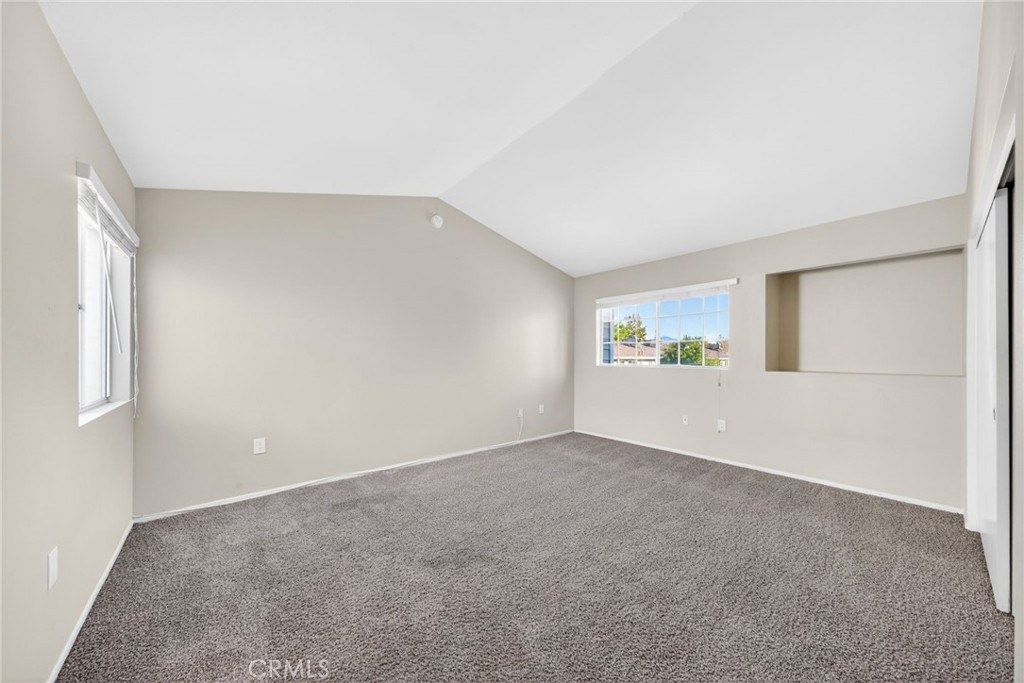 14380 Foothill Boulevard Sylmar, CA 91342 - Photo 16 of 27 a view of an empty room with closet and window