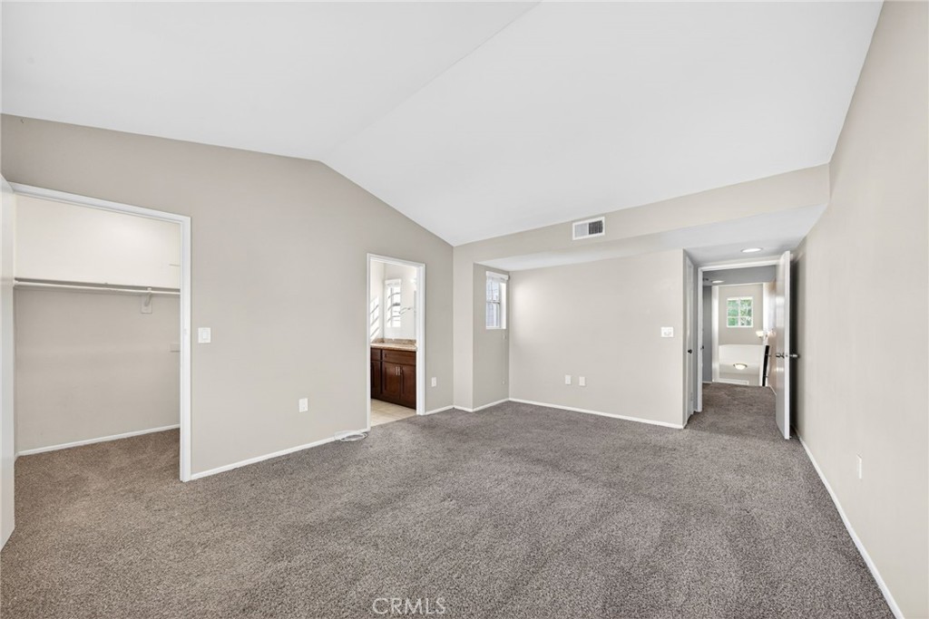 14380 Foothill Boulevard Sylmar, CA 91342 - Photo 20 of 27 a view of an empty room with window and wooden floor