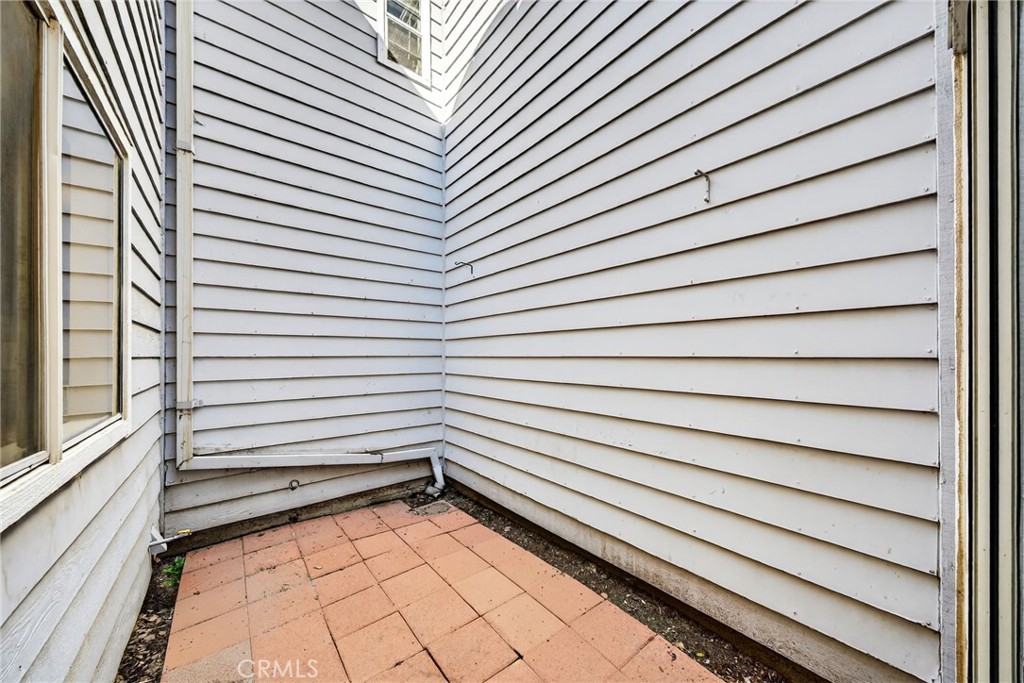 14380 Foothill Boulevard Sylmar, CA 91342 - Photo 23 of 27 a view of a room with stairs and a wooden floor