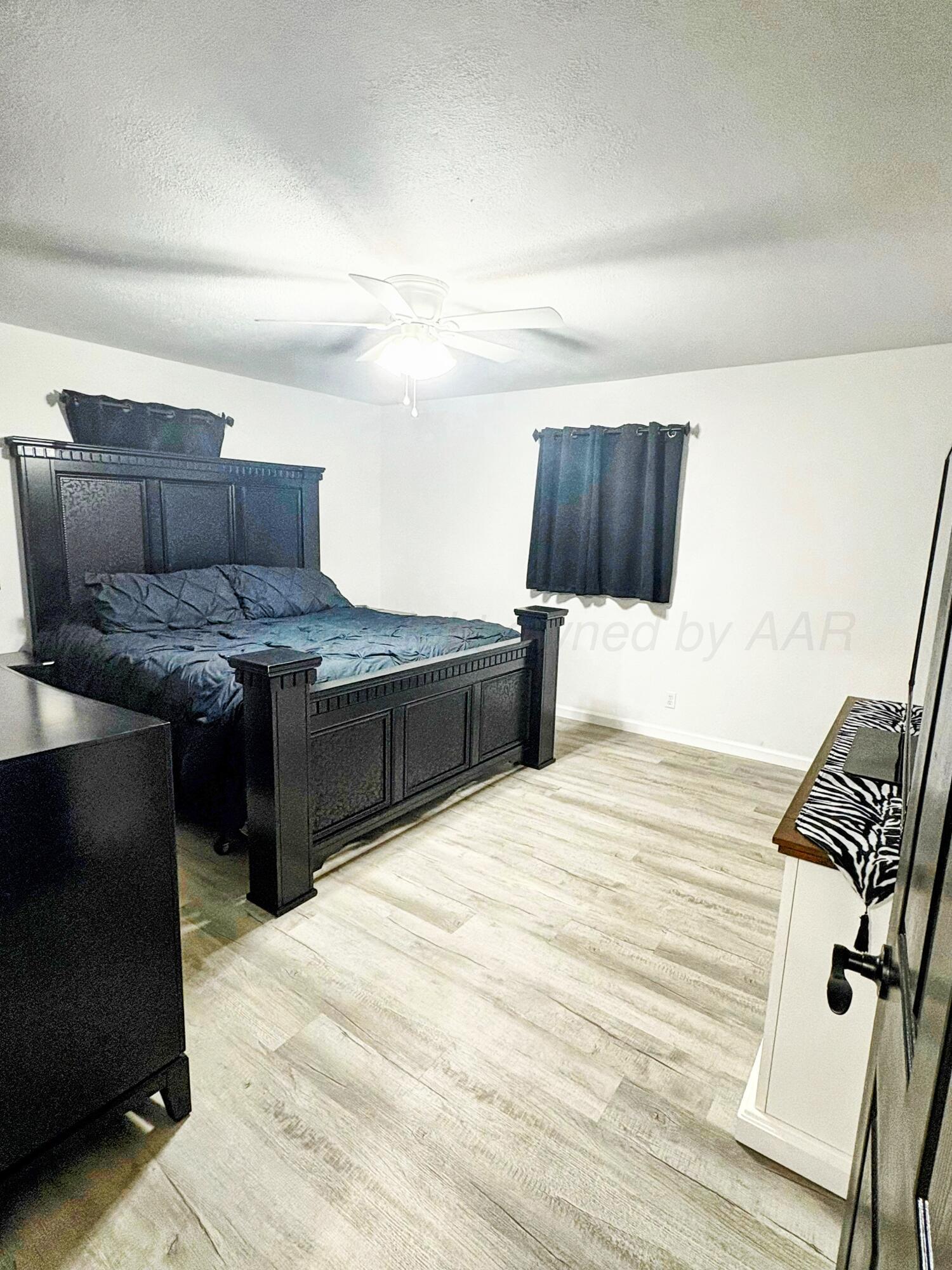 2310 Texas Street Perryton, TX 79070 - Photo 15 of 26 a view of kitchen and wooden floor