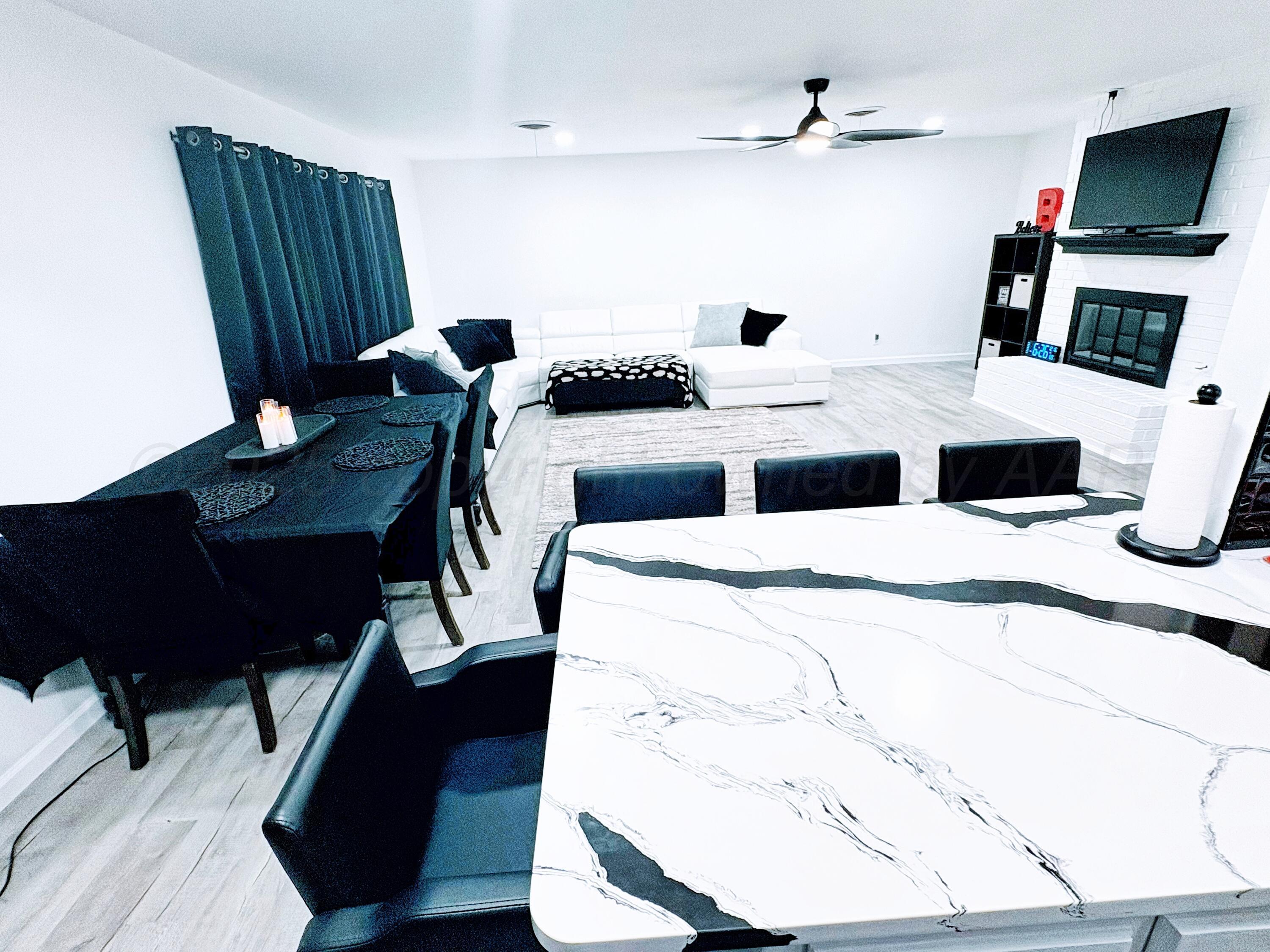 2310 Texas Street Perryton, TX 79070 - Photo 8 of 26 a bedroom with a bed and a television