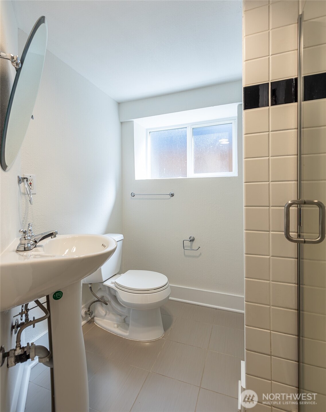 912 North 79th Street Seattle, WA 98103 - Photo 20 of 30 a bathroom with a sink toilet and shower