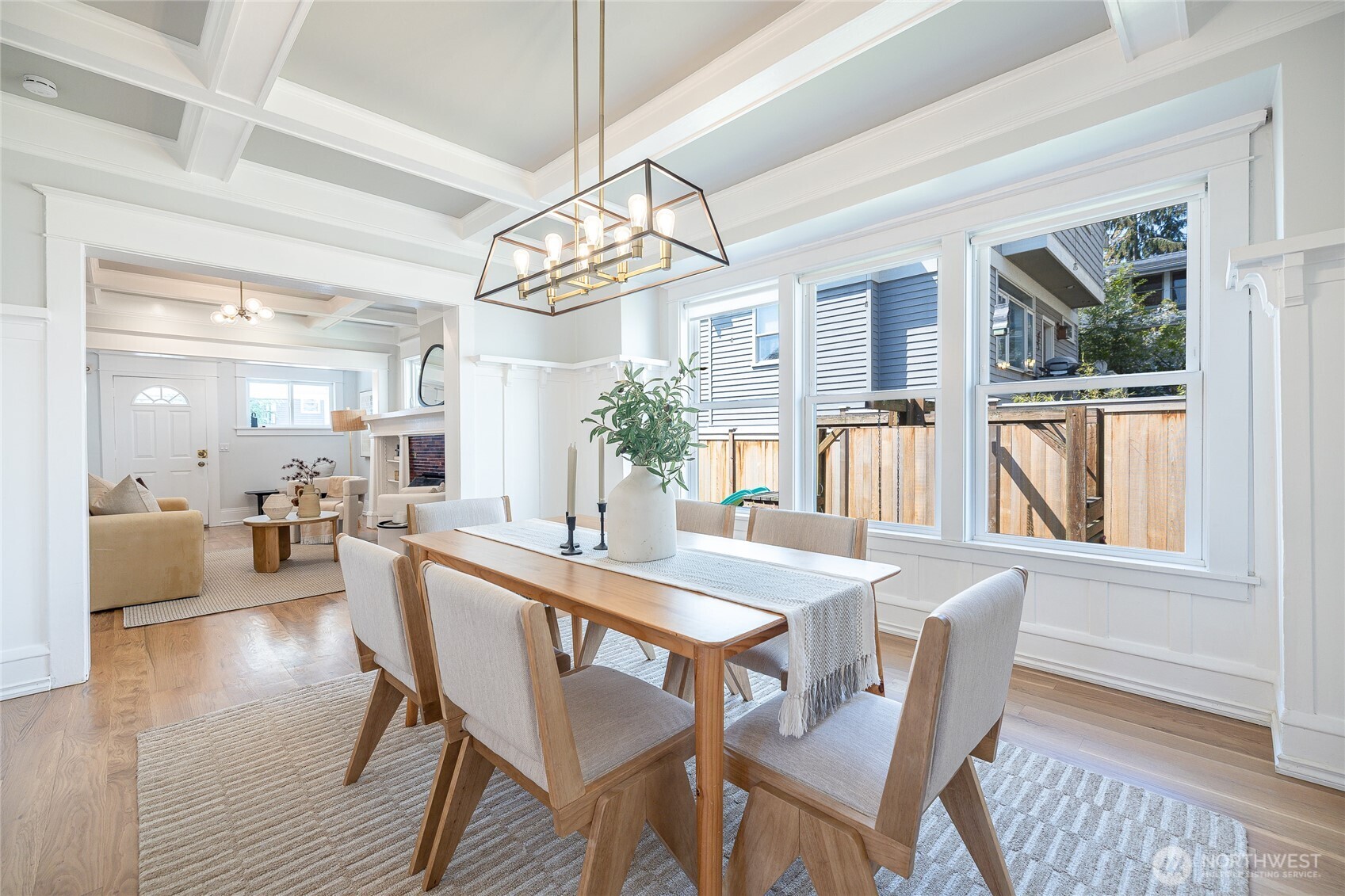 912 North 79th Street Seattle, WA 98103 - Photo 4 of 30 a dining room with furniture a chandelier and wooden floor