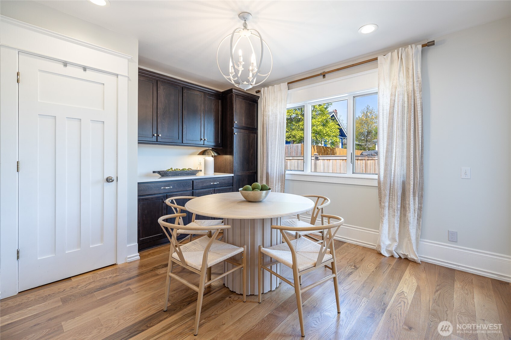 912 North 79th Street Seattle, WA 98103 - Photo 8 of 30 a view of a dining room with furniture window and wooden floor