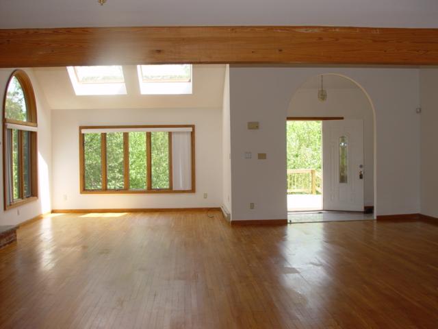 7204 High Knob Court Long Pond, PA 18334 - Photo 3 of 14 a view of an empty room with wooden floor and a window